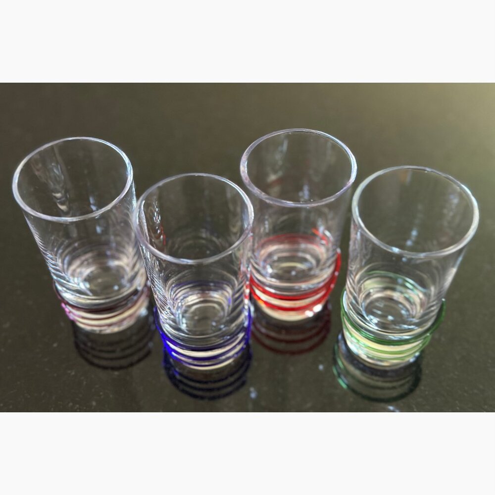 Set of 4 Shot Glasses with colored bands.